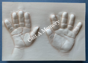 clay baby hand and foot prints - two hand impressions in clay