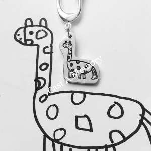 Giraffe drawing inscribed on silver pendant on keyring