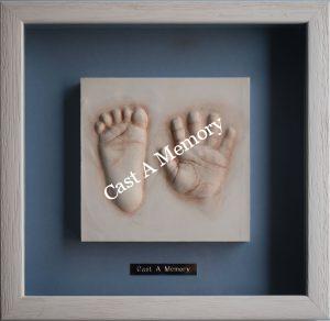 framed tile with hand and foot clay impression