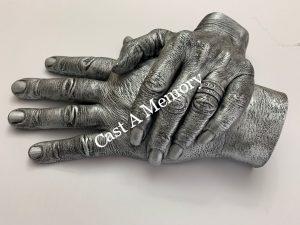 two hands together in cast