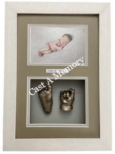 framed baby hand and foot cast with photo of sleeping baby