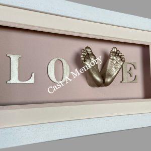 framed baby love cast with two feet in gold