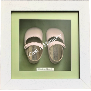 specialist framing of Pink first baby shoes in box frame